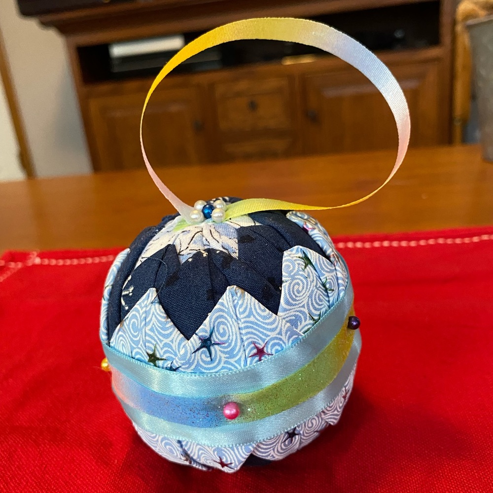 Hand made no sew quilt, ornament, blue, and multicolor sparkle. Beautiful.